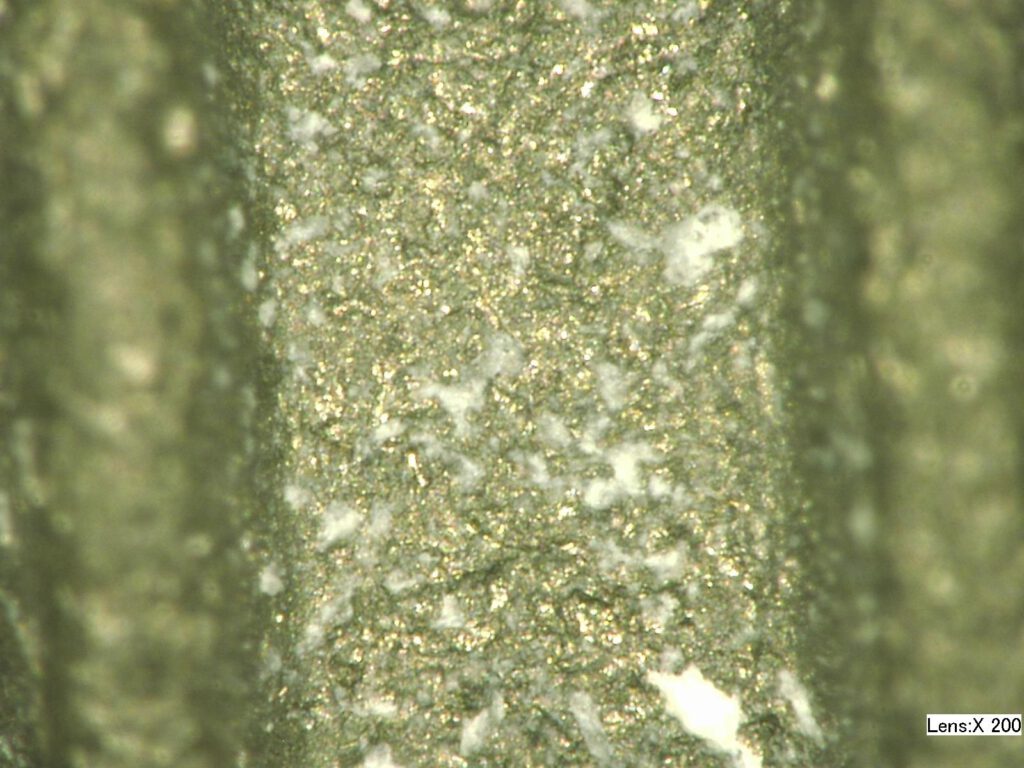 Surface texture on dental implant created by MicroBlasting.