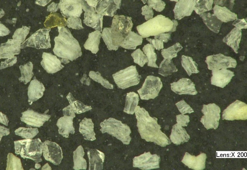 75 micron pumice particles at 200x; Comco MicroBlasting abrasives.