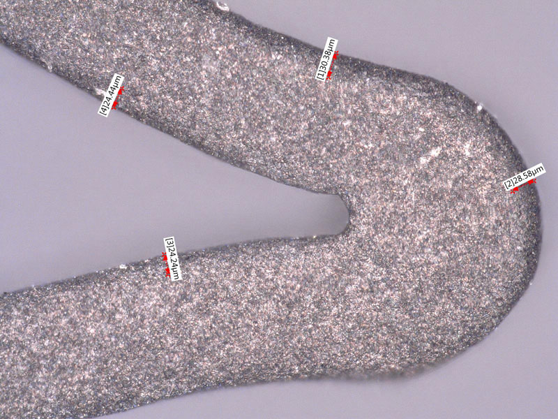 Stent surface (500x) after edge-rounding with 100-micron glass bead, followed by blasting with 17.5-micron aluminum oxide.